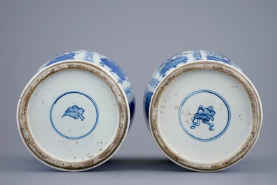 A pair of large Chinese blue and white vases and covers, Kangxi