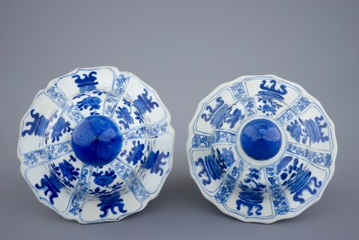 A pair of large Chinese blue and white vases and covers, Kangxi