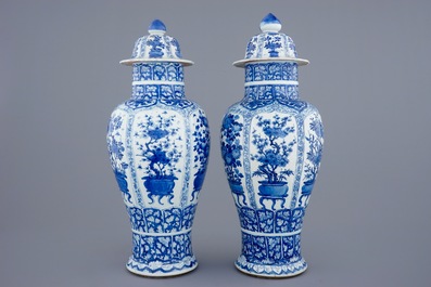 A pair of large Chinese blue and white vases and covers, Kangxi