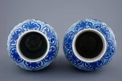 A pair of large Chinese blue and white vases and covers, Kangxi