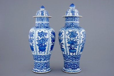 A pair of large Chinese blue and white vases and covers, Kangxi