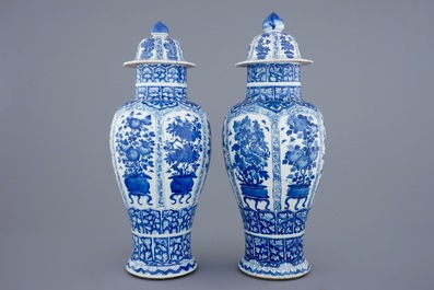 A pair of large Chinese blue and white vases and covers, Kangxi