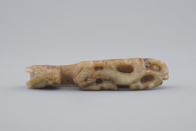 A Chinese mottled jade belt hook, 20th C.