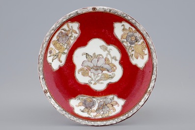 A Chinese eggshell ruby ground cup and saucer, Yongzheng, 1723-1735