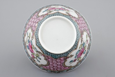 A Chinese famille rose eggshell cup and saucer with a cat near a flowervase, Yongzheng, 1723-1735