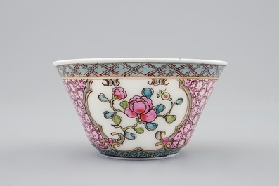 A Chinese famille rose eggshell cup and saucer with a cat near a flowervase, Yongzheng, 1723-1735
