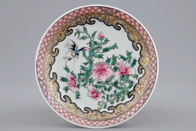 A Chinese famille rose eggshell cup and saucer with butterflies among flowers, Yongzheng, 1723-1735