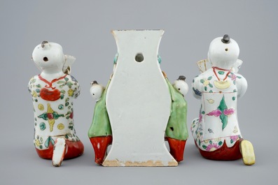 Two Chinese famille rose figures and a wall vase, 18/19th C.