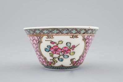 A Chinese famille rose eggshell cup and saucer with a cat near a flowervase, Yongzheng, 1723-1735