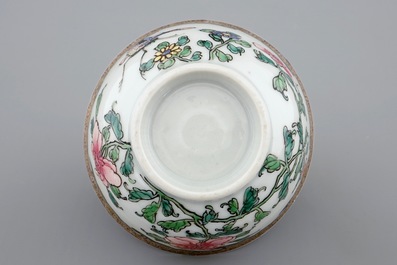 A Chinese famille rose eggshell cup and saucer with butterflies among flowers, Yongzheng, 1723-1735