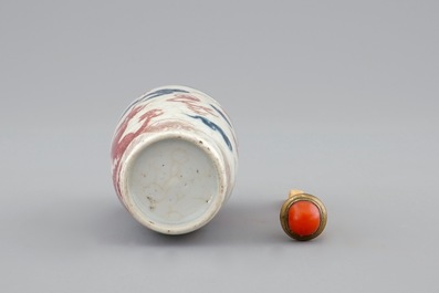 A Chinese blue, white and underglaze red snuff bottle, 18/19th C.