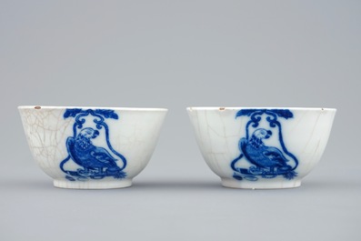A pair of Chinese blue and white cups and saucers with "The parrot on the perch", Qianlong, 18th C.
