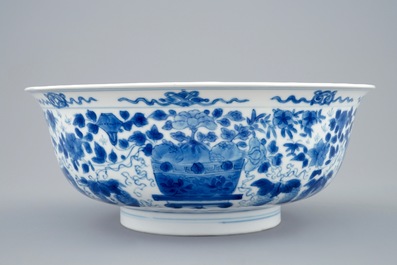 A Chinese blue and white dragon bowl with floral design, Kangxi