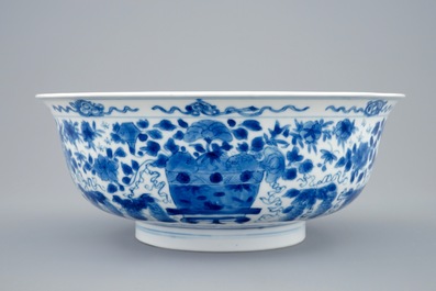 A Chinese blue and white dragon bowl with floral design, Kangxi
