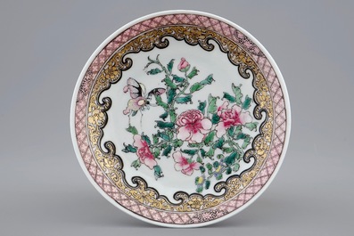 A Chinese famille rose eggshell cup and saucer with butterflies among flowers, Yongzheng, 1723-1735