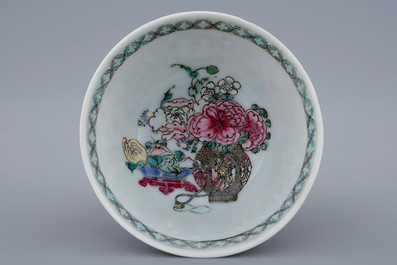 A Chinese famille rose eggshell cup and saucer with a central flowervase, Yongzheng, 1723-1735