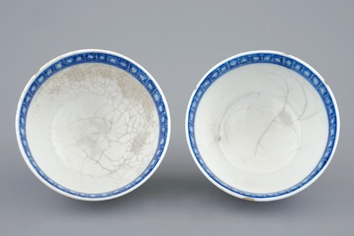 A pair of Chinese blue and white cups and saucers with "The parrot on the perch", Qianlong, 18th C.