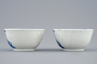 A pair of Chinese blue and white cups and saucers with "The parrot on the perch", Qianlong, 18th C.