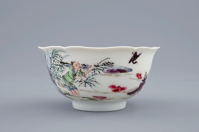 Een Chinese famille rose kop en schotel met decor van de visvangst, Yongzheng, 1723-1735