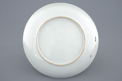 A Chinese famille rose plate with ladies in a garden, Yongzheng, 1723-1735