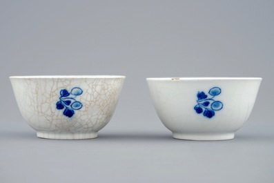 A pair of Chinese blue and white cups and saucers with "The parrot on the perch", Qianlong, 18th C.