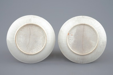 A pair of Chinese blue and white cups and saucers with "The parrot on the perch", Qianlong, 18th C.