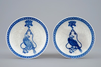 A pair of Chinese blue and white cups and saucers with "The parrot on the perch", Qianlong, 18th C.