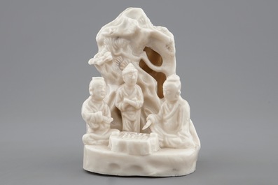 A Chinese blanc de Chine Dehua group of go-players beneath a pine tree, Kangxi