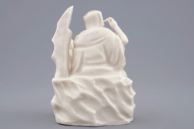 A Chinese Dehua blanc de Chine group of an immortal with a boy, 18/19th C.