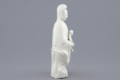 A Chinese Dehua blanc de Chine model of Guanyin with child, 19th C.