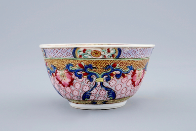 A Chinese famille rose eggshell cup and saucer with a cat, Yongzheng, 1723-1735
