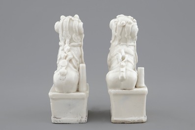 A pair of Chinese Dehua blanc de Chine buddhist lion joss stick holders, 18/19th C.
