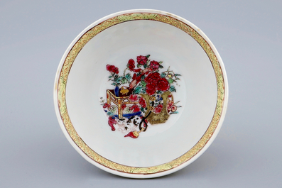 A Chinese famille rose eggshell cup and saucer with a cat, Yongzheng, 1723-1735