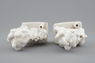 A pair of Chinese Dehua blanc de Chine buddhist lion joss stick holders, 18/19th C.