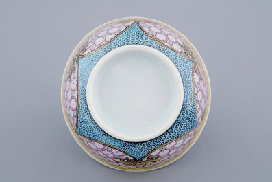 A Chinese famille eggshell rose cup and saucer with a central flowervase, Yongzheng, 1723-1735