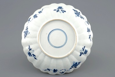 A lobed Chinese famille verte plate with shells among waves, Kangxi