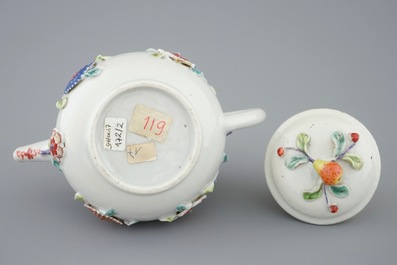 A Chinese moulded and applied famille rose teapot and cover on stand, Yongzheng, 1723-1735