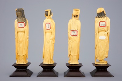 Un ensemble de 8 "Immortels" en ivoire sculpt&eacute; sur socles en bois, 19&egrave;me