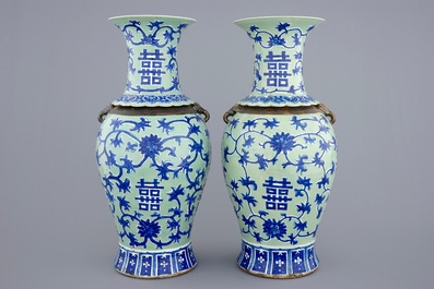 Een paar Chinese blauw-wit op celadon fond vazen met lotus scrolls, 19e eeuw