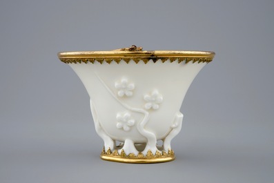 A Chinese blanc de Chine libation cup with gilt bronze mounts, Kangxi
