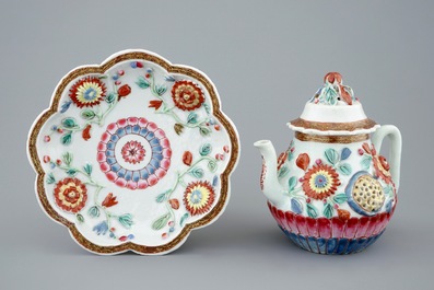 A Chinese moulded and applied famille rose teapot and cover on stand, Yongzheng, 1723-1735