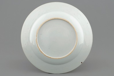 A rare Chinese famille rose European subject "Clothtraders" plate, Qianlong, ca. 1740