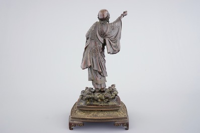 A fine Japanese bronze figure of a sage on base, Meiji, 19th C.