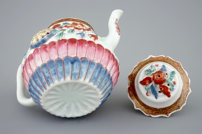 A Chinese moulded and applied famille rose teapot and cover on stand, Yongzheng, 1723-1735