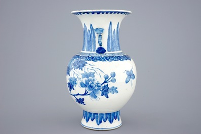 A Chinese blue and white vase with ruyi handles and a Kangxi-style plate, 19th C.