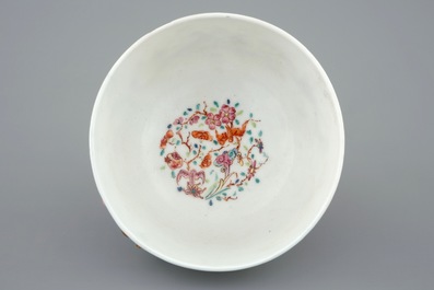 A Chinese relief-decorated famille rose cup and saucer with squirrels, Yongzheng, 1723-1735