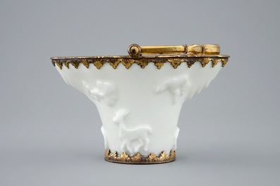 A Chinese blanc de Chine libation cup with gilt bronze mounts, Kangxi
