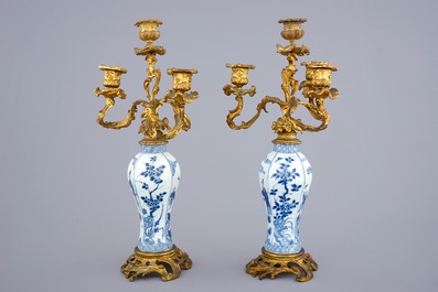 A pair of ormolu-mounted candelabra blue and white Chinese vases, Kangxi