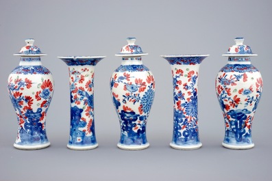 A small Chinese partly clobbered blue and white five piece garniture, Qianlong, 18th C.