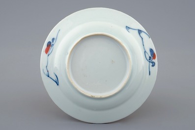 A Chinese Imari style cup and saucer with a parrot, Qianlong, 18th C.